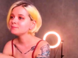 Blonde in lingerie on live webcam shows butt