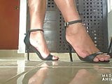 Sexy feet in high heel strappy sandals